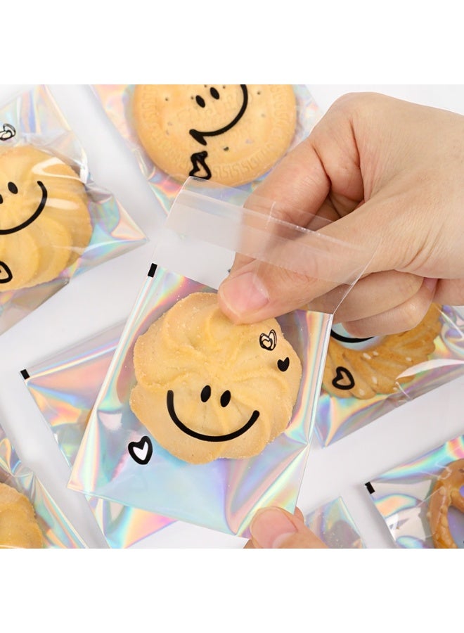 RTYY 100 كيس لاصق ذاتي للبسكويت، أكياس سيلوفان قابلة لإعادة الإغلاق، أكياس بلاستيكية مزينة بتعبيرات لطيفة لخبز البسكويت والحلوى، أكياس بلاستيكية شفافة للحلويات، أكياس تغليف فردية للحلوى، أكياس سيلوفان لتوزيعات الحفلات، لتغليف البسكويت والشوكولاتة والوجبات الخفيفة والمخبوزات (10 × 10 سم). - Image 5